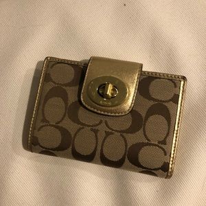 Coach wallet in gold with classic Coach pattern